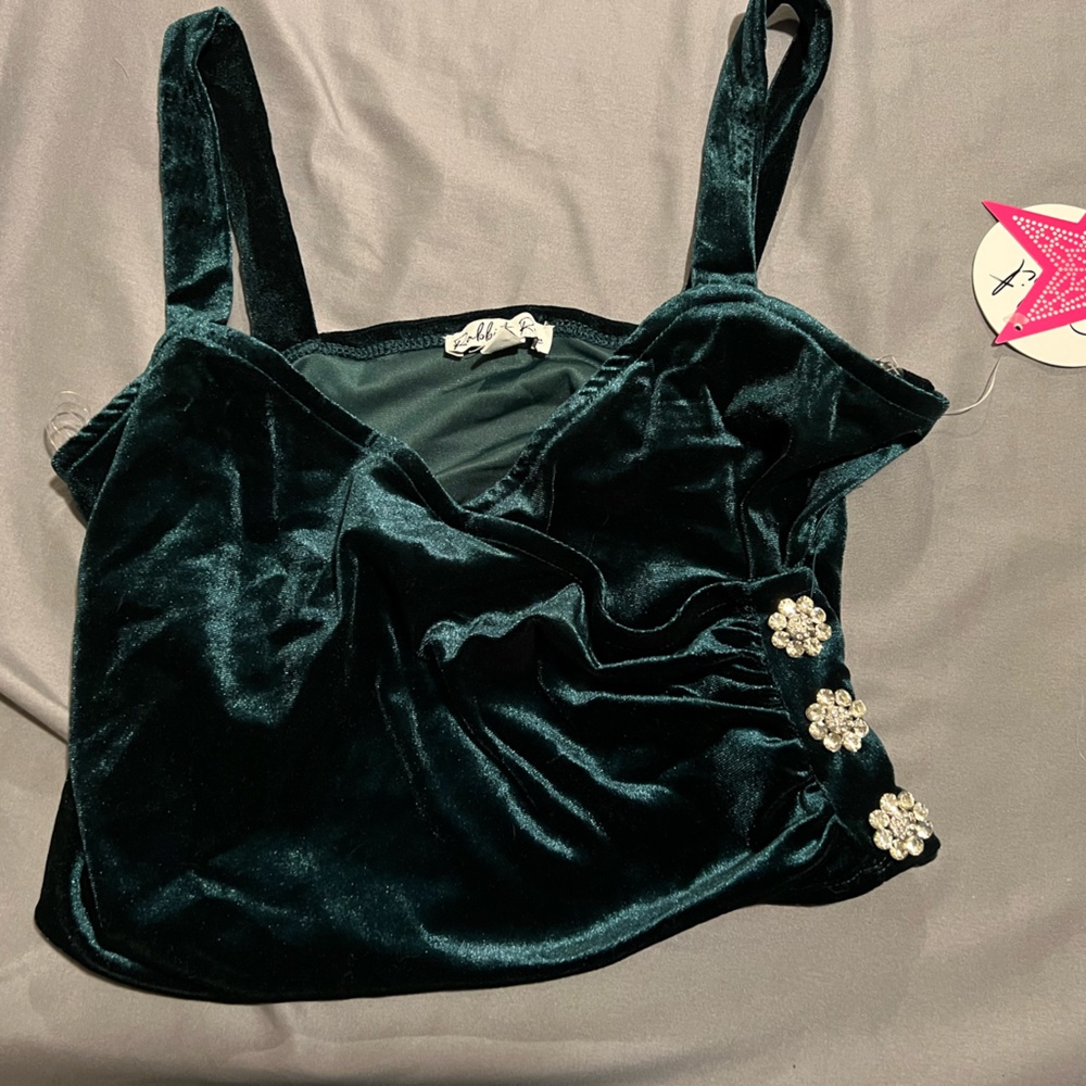 Green crop top and black skirt/shorts